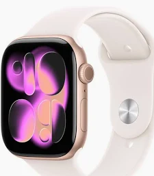 Close nítido e detalhado do Apple Watch Series 11 na cor Ouro Rosa (Rose Gold). O relógio possui caixa de alumínio polido e uma pulseira de esporte na cor estelar (starlight). A tela Always-On Retina está ativada, mostrando um mostrador de horas analógico clássico e minimalista. O dispositivo repousa elegantemente sobre uma superfície de mármore branco veado, com luz natural suave realçando o acabamento metálico.